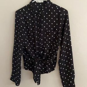 S Black blouse w/ white polka dots.Ties at waist.